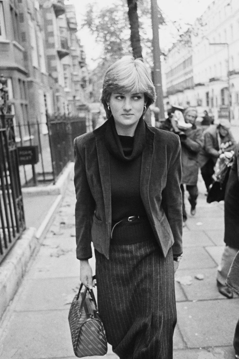 Diana Spencer being followed by the press