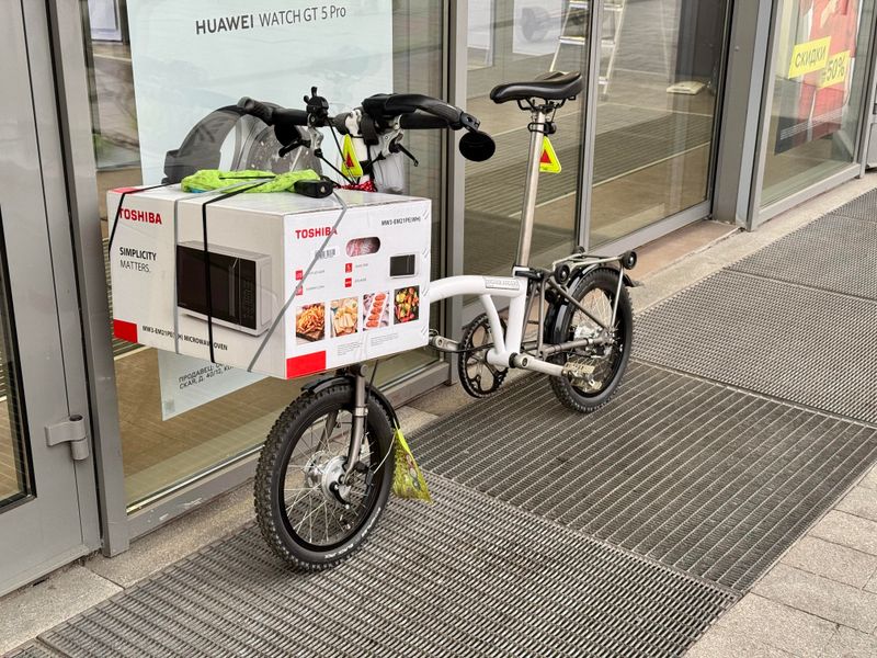 No Carrying a Microwave While Riding a Bicycle