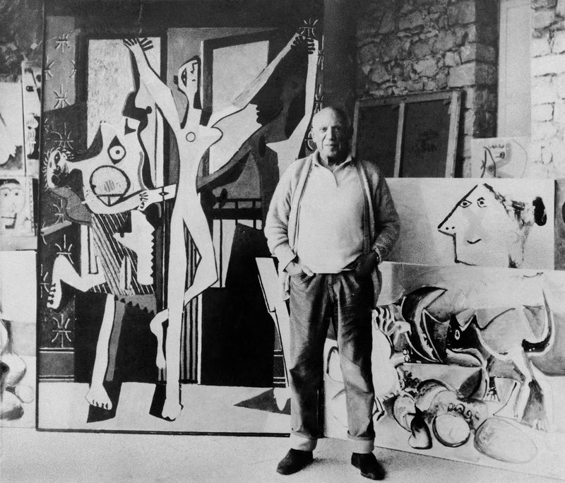 Pablo Picasso Next to His Painting