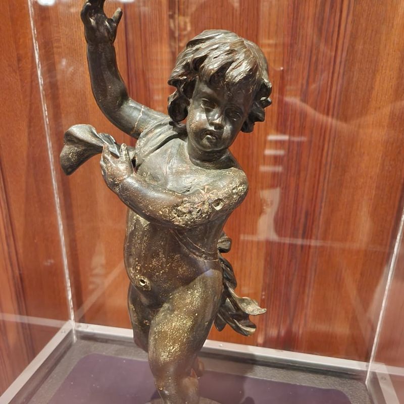 Broken cherub statue