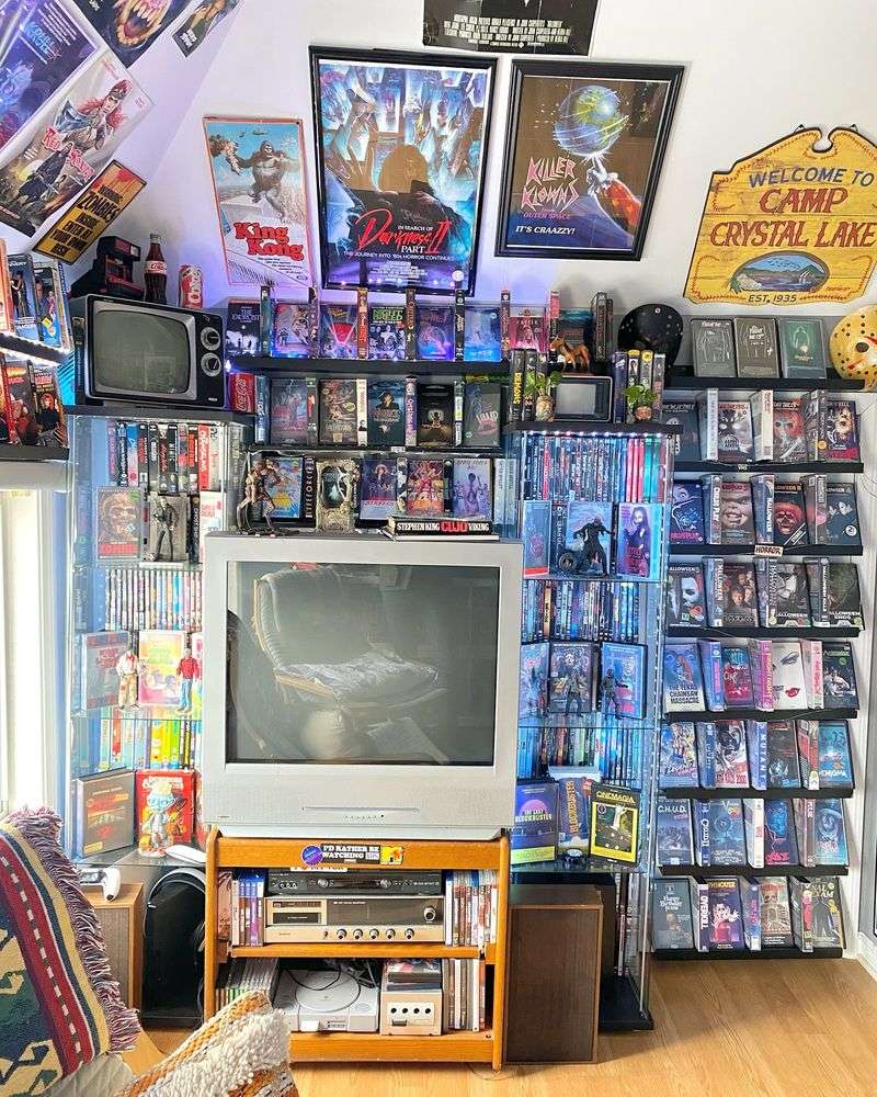VHS Tape Collection Next to a CRT TV