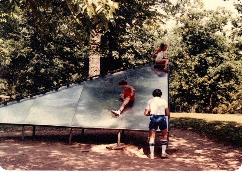Playing on Metal Playground Equipment in the Summer