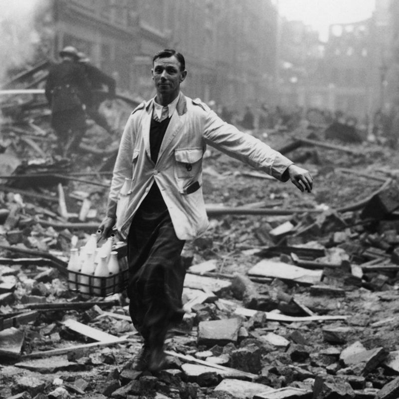 The milkman calmly at work during the London Blitz (1940)