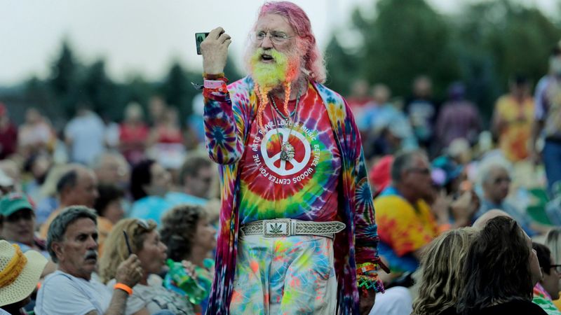Peace Signs & Flower Crowns – Hippies flashing peace signs and wearing flowers in their hair
