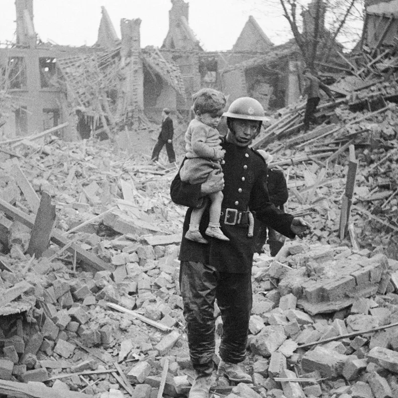 Fireman Carries Boy Out of the Rubble