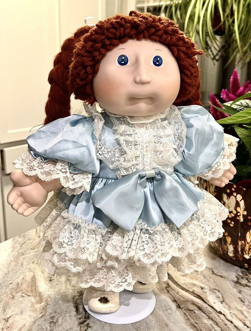 Cabbage Patch or Porcelain Dolls on Display