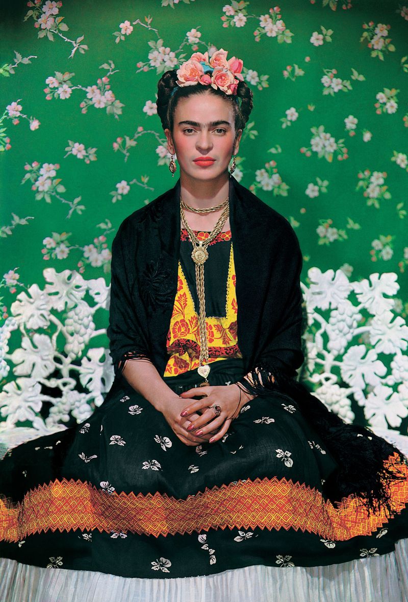 Frida Kahlo – Defiant and artistic in her Tehuana dresses.