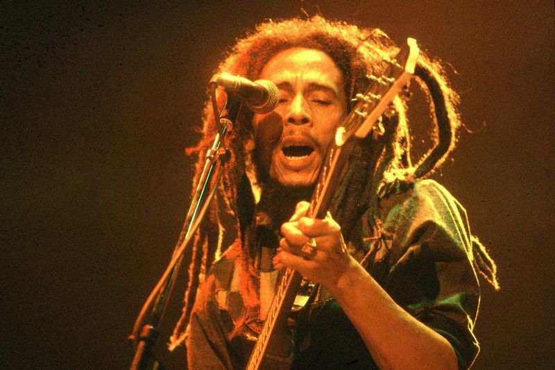 Bob Marley – Relaxed yet powerful, mid-performance with his guitar.