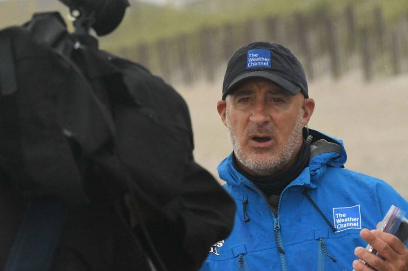 Weatherman's Battle With Stubborn Hat
